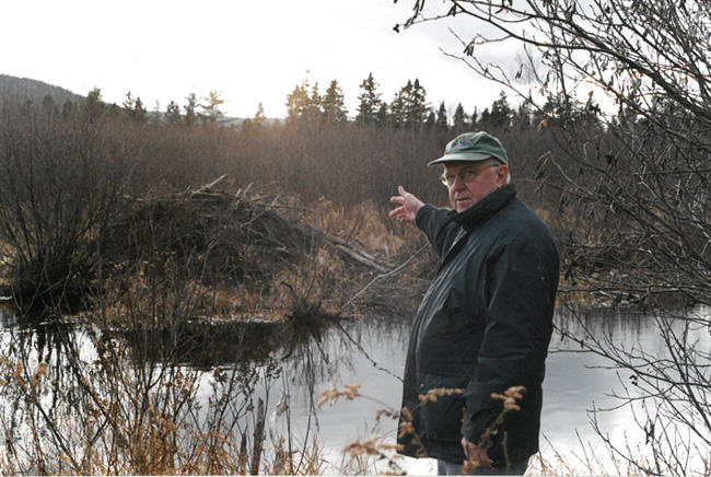 Neal Jotham with beaver lodge